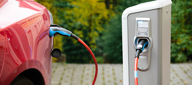 EV vehicle being charged before shipping